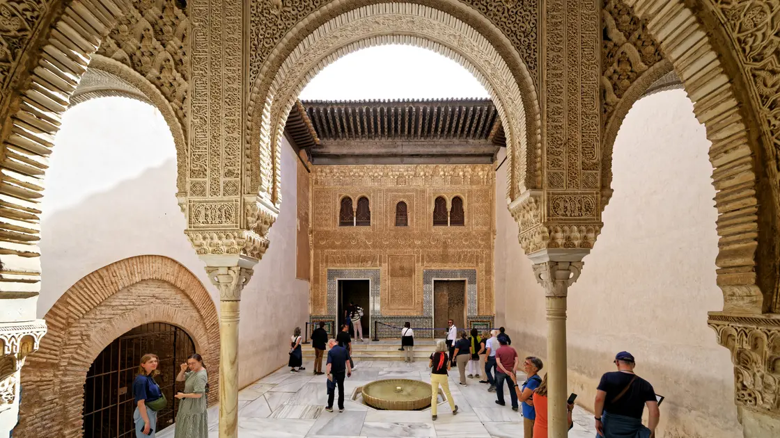 The Alhambra palace complex viewed from the Albaicin hillside, with the Sierra Nevada mountains behind