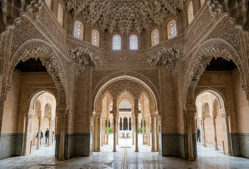 Interior of the Alhambra's Nasrid Palaces, Granada — ornate muqarnas ceiling and horseshoe arches, the palace handed over by Boabdil, last Moorish king, in 1492