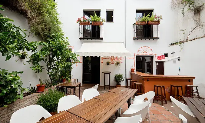 Rooftop terrace of Oasis Backpackers Hostel Granada with views of the Alhambra