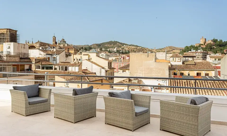Rooftop pool at Room Mate Leo Granada with Alhambra views in the background